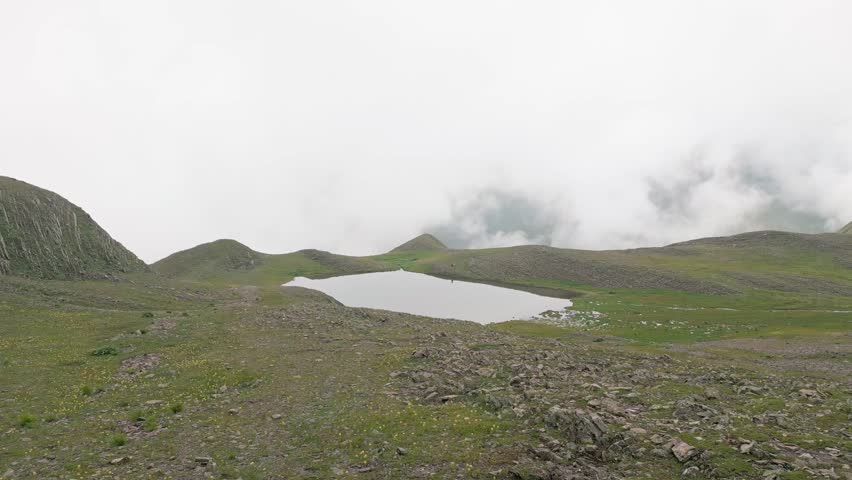 Aerial static panorama alpine Sakori lake in country of Georgia. Hiking trekking destination - hidden gem in caucasus mountains. Chiaukhi massif. Greater caucasus. Chokhi - Sakori lake trail concept