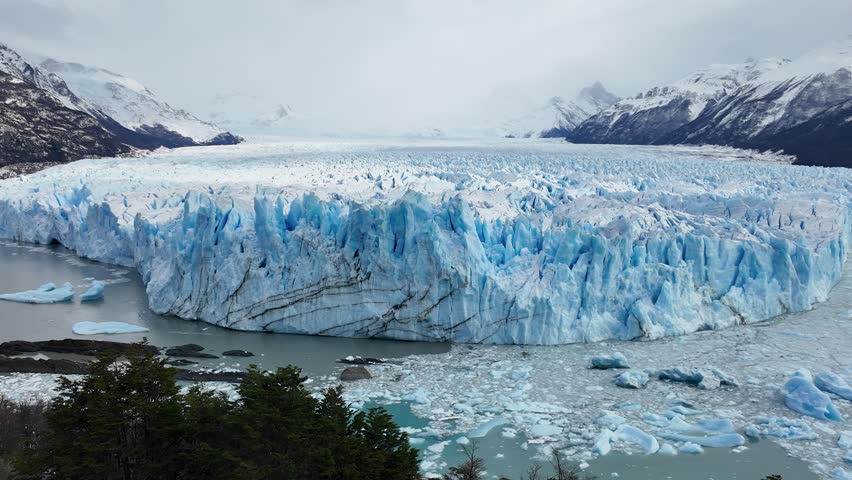 Perito Moreno Glacier At El Calafate In Santa Cruz Argentina. Stunning Landscape. Los Glaciares National Park. Iceberg Background. Perito Moreno Glacier At El Calafate In Santa Cruz Argentina.