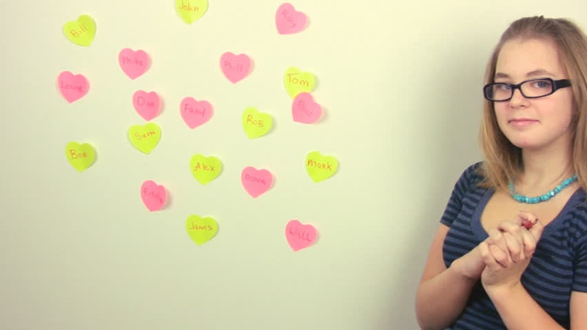 Teenage girl in glasses remembers all her boyfriends, wrote their names on