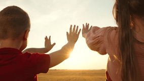 little child kid boy girl stretch their hand sun, ray fingers, vacation travel, sun playful children, children sunset faith, sun embracing childhood, outdoor family gathering, children's nature - Powered by Shutterstock - Get 15% off with code: PIKWIZARD15