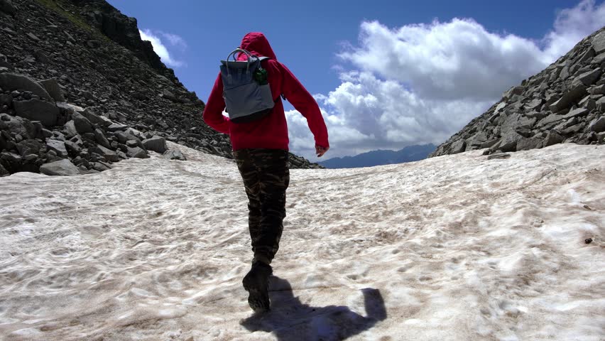 Boy walks on the glaciers of the Nambrone Valley
