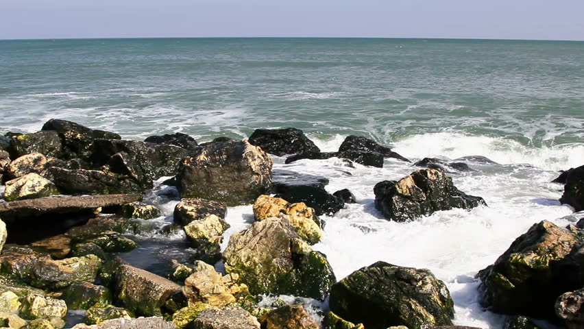 Sea waves hitting rocks on the coast