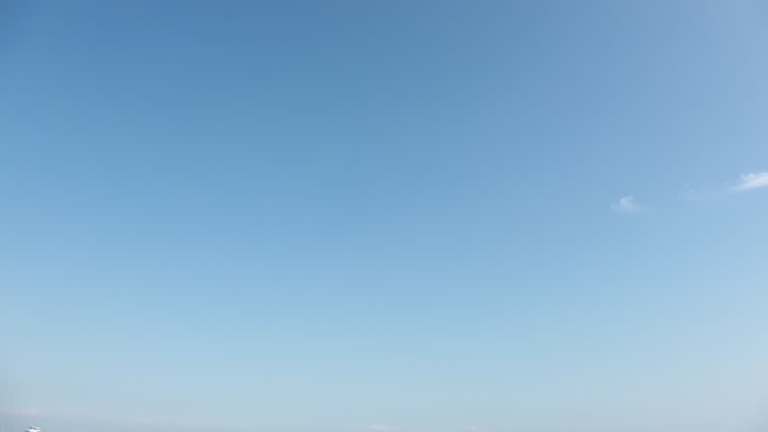 KOBE, HYOGO, JAPAN - JUNE 2024 : Aerial high angle view of Kobe city and Kobe port in daytime. View of buildings and street around Kobe port tower and Sannomiya station.