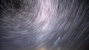 4k Time Lapse Night Starry Sky Stars And Meteoric Track Trails. Amazing Stars Effects In Sky. Spin Of Stars In Sky. Unusual Stars Rotate Of Star Trails On Night Background. Time Lapse, Timelapse, Time - Powered by Shutterstock - Get 15% off with code: PIKWIZARD15