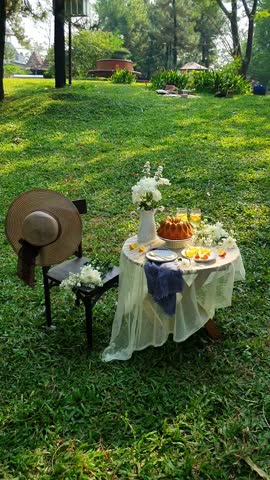 Tea time, traditional English tea ceremony with Afternoon tea cakes, sandwiches and teapot with hot tea. Sweet tasty cakes and desserts with greenery on background.