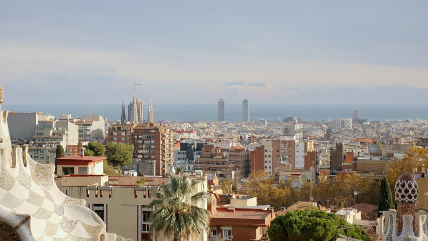 View of Barcelona from Park Guell, architectural buildings, fountain, and cityscape against the horizon. High quality 4k footage