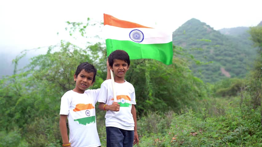 Group of happy Indian holding indian tricolour flag celebrating Independence day or Republic day.