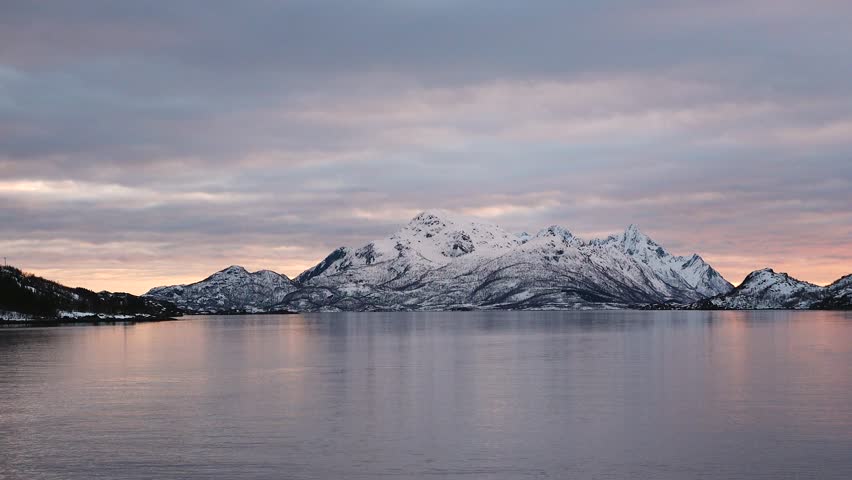 Exploring the breathtaking ice landscapes of Antarctica at sunset, showcasing stunning reflections and icy formations
