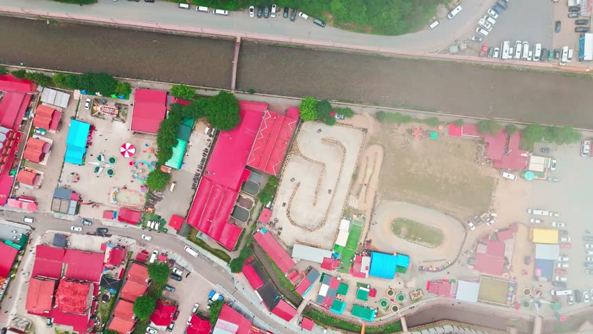 5th of July in Uzung�l, Trabzon, Turkiye Footage of Aerial view of a village square with a park and surrounding buildings.