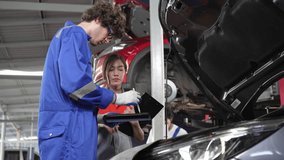 Mechanic checking and repairing with sales agent employee at auto repair shop. After service car maintenance concept - Powered by Shutterstock - Get 15% off with code: PIKWIZARD15