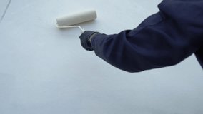 Close up of painter hand holding brush painting white wall. Home painting and decorating concept. House for sale or real estate. - Powered by Shutterstock - Get 15% off with code: PIKWIZARD15