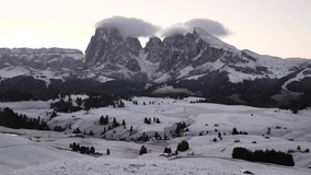 Mountains and hills with snow at sunrise - Backlight panoramic video of Dolomites in winter with snow on the valley - Nature and travel concepts - Powered by Shutterstock - Get 15% off with code: PIKWIZARD15