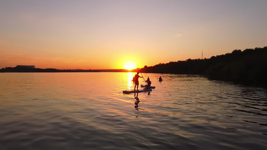 Womans silhouettes on Water, Sup board, paddle boarding in slow motion