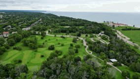 Lake Park, Wisconsin Overlooking Lake Michigan; Milwaukee County Parks And Recreation. 4K Aerial Reverse Over The Golf Course And Lighthouse. - Powered by Shutterstock - Get 15% off with code: PIKWIZARD15