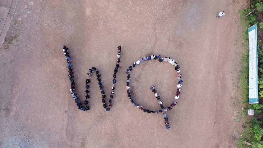 Drone Capture of People Lined Up in the Shape of Letters