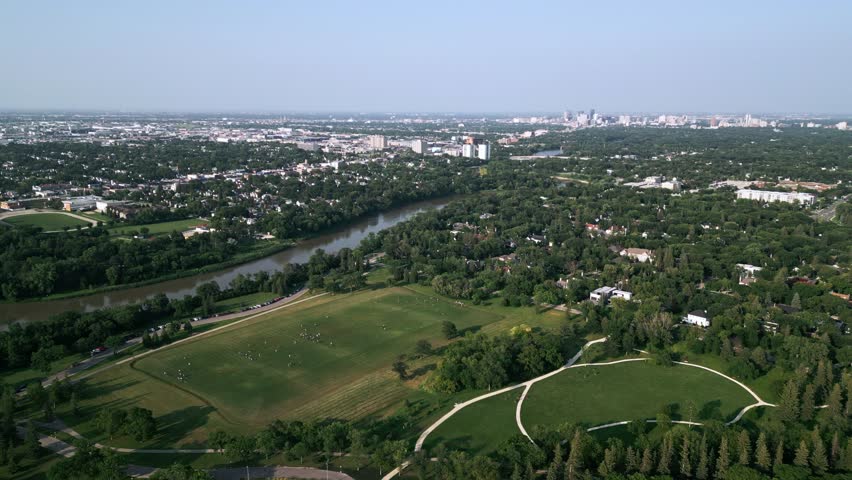 High Aerial View of Assiniboine River and Urban Canopy at Golden Hour