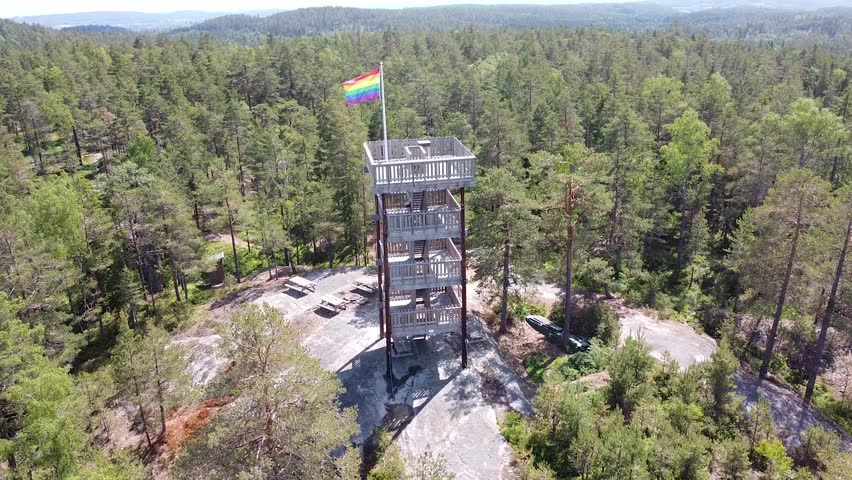 Wooden observation tower with a rainbow flag