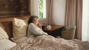 Asian senior mature woman patient taking medicine pill for relief influenza disease illness in bedroom. Elderly retired woman discomfort get sick from cold, flu, cough. Old people self care at home. - Powered by Shutterstock - Get 15% off with code: PIKWIZARD15