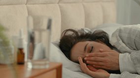 Sick woman lying in bed bedroom home flu coronavirus pandemic virus girl coughing female rest sleep treatment unhealthy disease suffer fever nap bad feeling illness cold contagious infection medical - Powered by Shutterstock - Get 15% off with code: PIKWIZARD15
