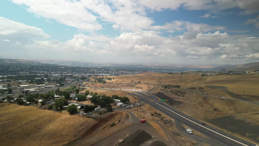 Wide aerial of Lewiston Idaho on smoky day from hills and highway 95