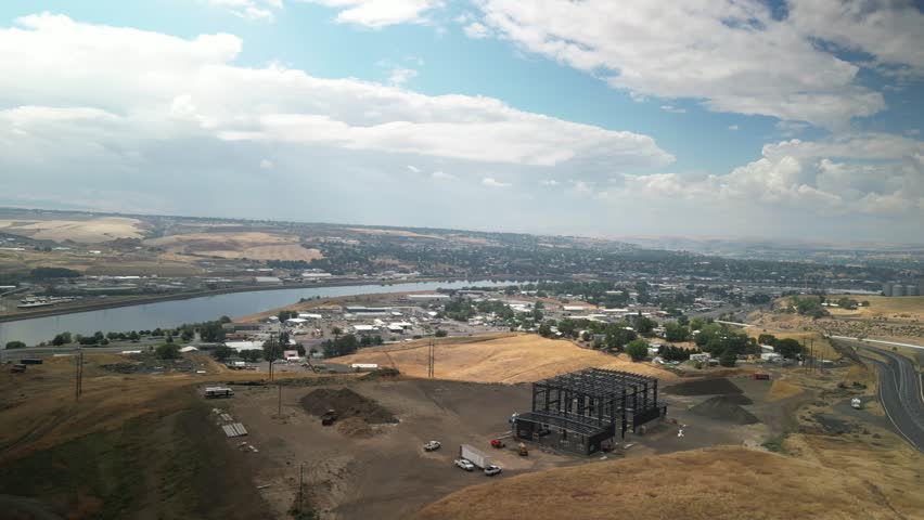 Wide aerial of Lewiston Idaho town with industrial plants along Clearwater River