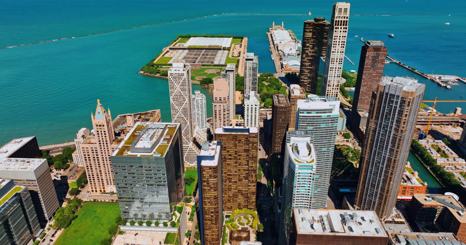 Modern diverse imaginative buildings at the backdrop of azure waterscape. Beautiful lakefront of Chicago, Illinois, the USA from top view.