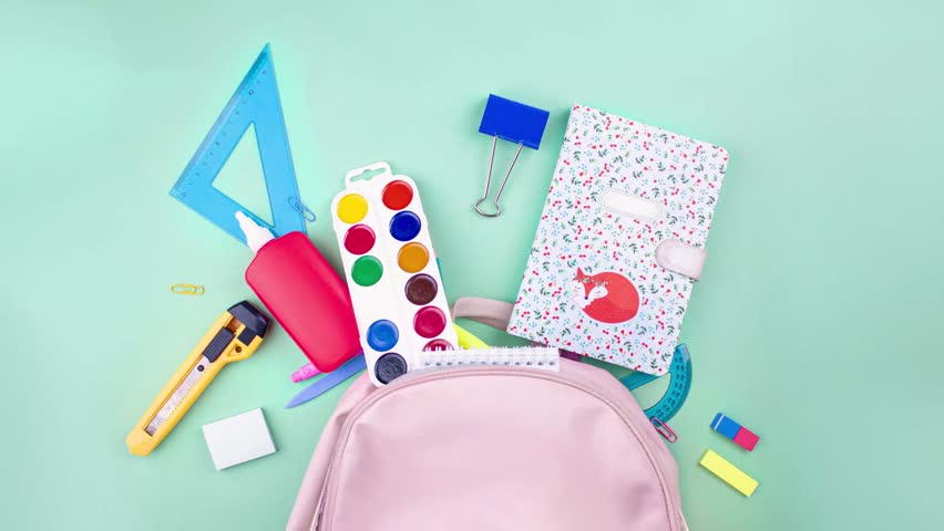 Colorful school supplies moving from school pink bag on mint green background. Back to school concept. Stop motion animation. Flay lay top view school supplies pastel colors
