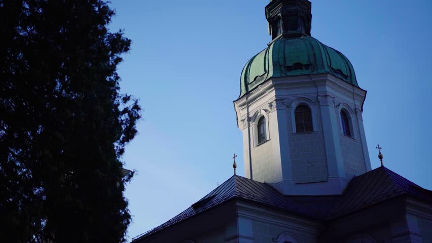 Revealing church tower of basilica in Salzburg Austria at sunset