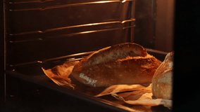 In the oven, sourdough bread bakes to a beautiful crispy crust. Opening the oven after baking, steam rises as the bread is removed. - Powered by Shutterstock - Get 15% off with code: PIKWIZARD15