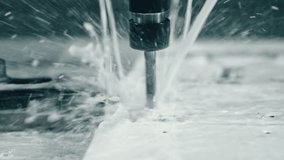 Power drill piercing metal with coolant spray for precision machining in an industrial workshop. Close-up view of drilling process with water lubrication - Powered by Shutterstock - Get 15% off with code: PIKWIZARD15