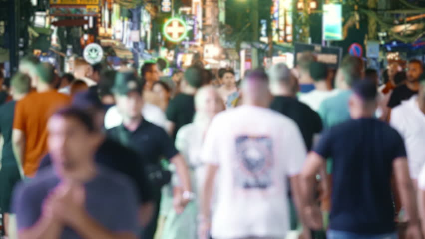 Many people walk Thai club city street time lapse. Fun Thailand night life. Rush hour crowd timelapse. Lot drunk tourist hang out nightclub. Busy pedestrian pass by nightlife bar Urban neon light sign