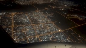 View from the airplane window. Night metropolis. The plane is getting ready to land. - Powered by Shutterstock - Get 15% off with code: PIKWIZARD15
