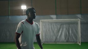 Professional soccer player training in stadium, scoring goal to gate, slowmotion - Powered by Shutterstock - Get 15% off with code: PIKWIZARD15