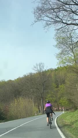 a cyclist rides on a highway outside the city