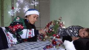 new year, christmas holiday, decoration, christmas tree decorations, gifts, pampering, family, mother with son and daughter, newborn sweater, door decoration, wreath, santa hat, teenagers, childhood - Powered by Shutterstock - Get 15% off with code: PIKWIZARD15