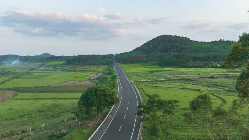 Aerial photography of the national highway and farmland in the countryside of Tunchang, Hainan