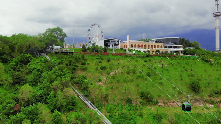 Aerial drone shot following cable car up to Kok Tobe Hill in Almaty Kazakhstan