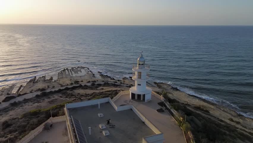 Lighthouse against the background of the sea, top view, shooting from a quadcopter, Spain, Alicante, Cabo de Huertas.