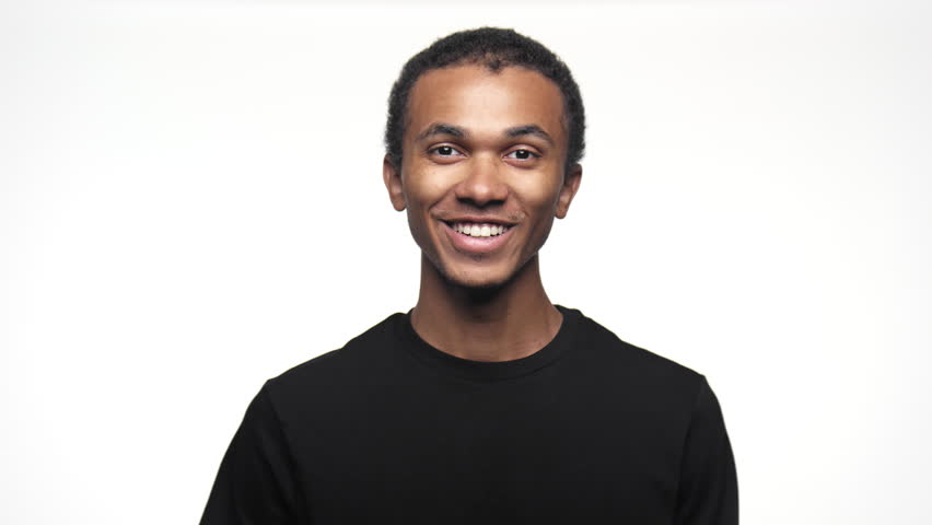 Happy Young Man Giving Thumbs Up with a Big Smile