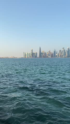 The sea view and skyline of West Bay in Doha, Qatar. Vertical orientation 