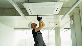 Technician worker repairing air conditioner in home or office - Powered by Shutterstock - Get 15% off with code: PIKWIZARD15