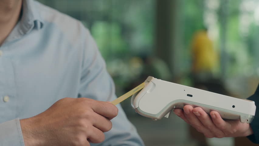 Customer pay food order lunch in cafe unrecognizable man contactless payment technology NFC on phone waiter serving visitor in restaurant male guy paying bank app mobile terminal scan cashless service