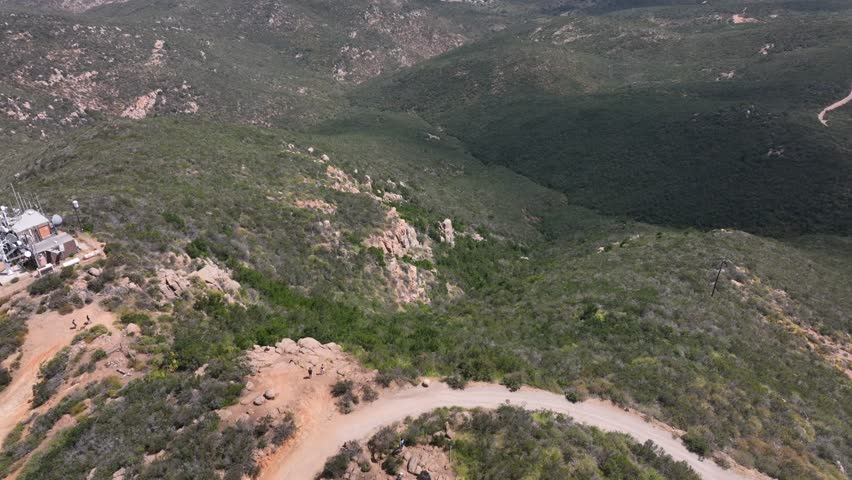 Aerial view of hiking trails in Mission Trails on Cowles Mountain during a sunny and partly cloudy day in San Diego California