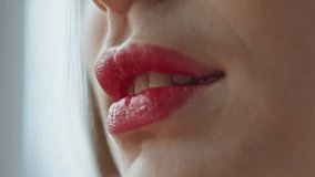 Closeup girl removing red lipstick with cotton pad at cozy apartment. Unrecognizable woman rinsing off cosmetics wiping visage enjoying face beauty routine in bathroom. Skincare procedures concept - Powered by Shutterstock - Get 15% off with code: PIKWIZARD15