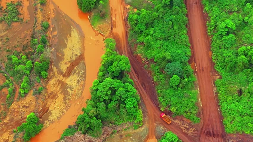aerial video of nickel mining activities and activities of loading nickel ore onto barges or barging