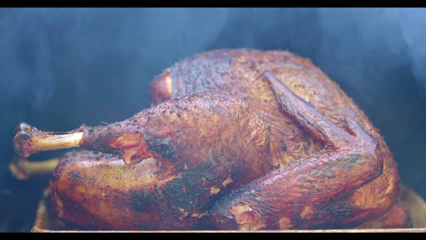 Whole Turkey Cooked Smoking on Barbecue Grill 
