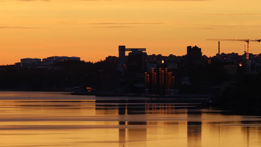 Stockholm, Sweden The sunrise over the Baltic Sea and the Kvarnholmen district. 