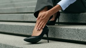 Unrecognizable woman stylish fashion problem African girl cropped view female legs foots businesswoman business in city wear high heels feel ache discomfort pain in ankle medicine dislocation injury - Powered by Shutterstock - Get 15% off with code: PIKWIZARD15