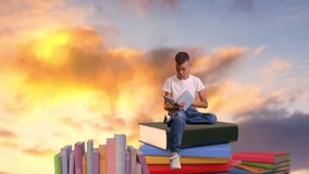 A young boy sits on a stack of books and reads - Powered by Shutterstock - Get 15% off with code: PIKWIZARD15