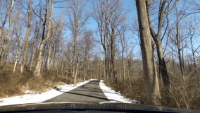 driving road in national park in winter with snow on the ground - Powered by Shutterstock - Get 15% off with code: PIKWIZARD15